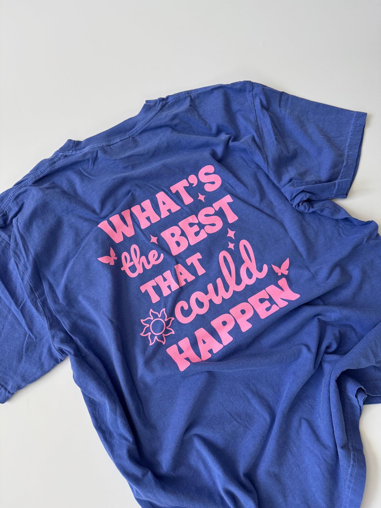 Heathered blue graphic t-shirt with “All Good Days” front design and “What’s the Best That Could Happen” back print, unisex fit